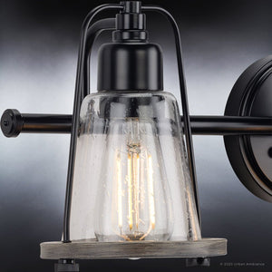 An Urban Ambiance UHP4076 Coastal Bath Light 8.25''H x 24''W with a Midnight Black Finish is a unique and gorgeous lamp from the Kempsey Collection featuring a