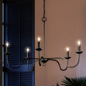 An UHP4080 Traditional Chandelier 18''H x 30.125''W, Midnight Black Finish, Warwick Collection adding luxury to a room with a window.