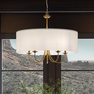 A gorgeous UHP4090 New Traditional Chandelier with a unique Aurora Collection design is showcased in a room with a view of the mountains.