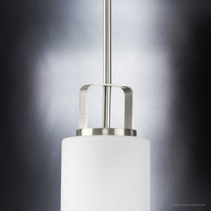 A beautiful and luxurious modern pendant lamp from the Broome Collection with a white glass shade.