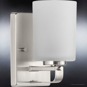 A unique and luxurious Urban Ambiance UHP4104 Modern Wall Sconce 8''H x 4.5''W, Brushed Nickel Finish, Broome Collection with a white glass