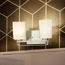 A beautiful and unique UHP4105 Modern Bath Light 7.625''H x 13.625''W with a geometric pattern on the wall by Urban Ambiance.