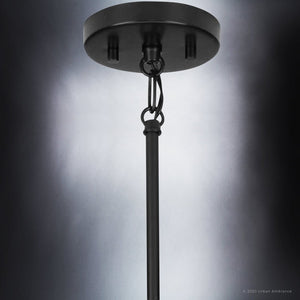 A UHP4111 Modern Pendant 11''H x 5''W, Midnight Black Finish, Broome Collection hanging on a black background is a gorgeous and luxurious lighting option by Urban Ambiance