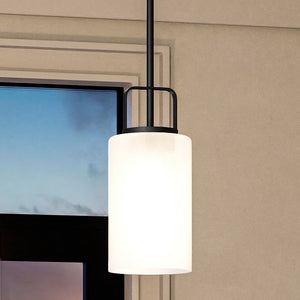 A beautiful Urban Ambiance UHP4111 Modern Pendant lamp hanging over a window in a room.