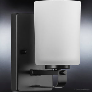 A unique lighting fixture, the UHP4112 Modern Wall Sconce features a white glass shade.