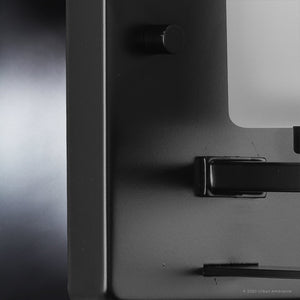 A close up of a luxury lighting fixture, the UHP4112 Modern Wall Sconce 8''H x 4.5''W in Midnight Black Finish from the Broome Collection by