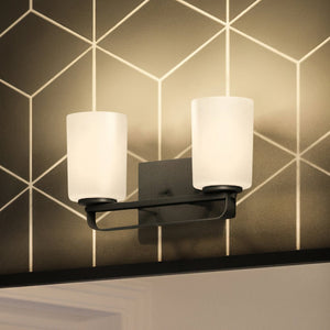 Two beautiful UHP4113 Modern Bath Light 7.625''H x 13.625''W, Midnight Black Finish, Broome Collection lighting fixtures on a wall in a bathroom by Urban