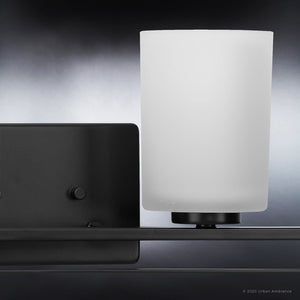 A unique and luxurious UHP4115 Modern Bath Light 7.625''H x 32.5''W, Midnight Black Finish, Broome Collection wall lamp with a white cup on it