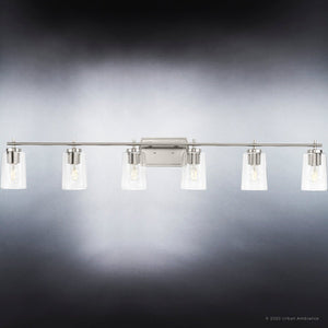 A beautiful lighting fixture from the Esperance Collection with clear glass shades in a brushed nickel finish.