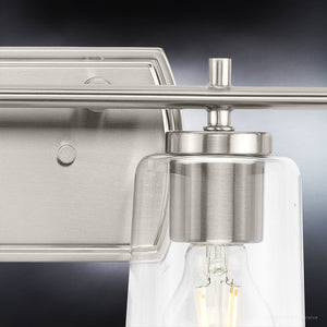 An Urban Ambiance bathroom light fixture with the UHP4144 Traditional Bath Light 7.625''H x 48.5''W, Brushed Nickel Finish, and unique clear glass bulb