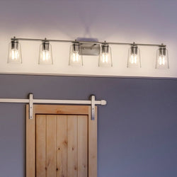 A bathroom with a unique lighting fixture - an Urban Ambiance Traditional Bath Light 7.625''H x 48.5''W, Brushed Nickel Finish, Esperance Collection fixture