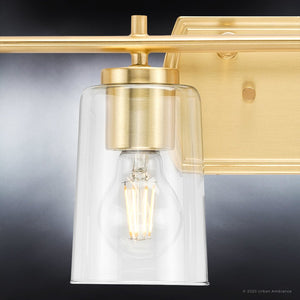 An Urban Ambiance bathroom lighting fixture with a UHP4149 Traditional Bath Light 7.625''H x 48.5''W, Satin Gold Finish, Esperance Collection clear glass