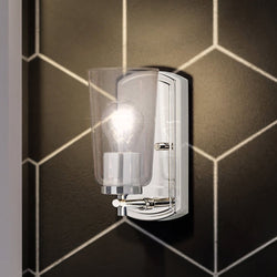 A bathroom with a unique lighting fixture, the Urban Ambiance UHP4150 Traditional Wall Sconce 7.75''H x 4.5''W, Polished Nickel Finish,