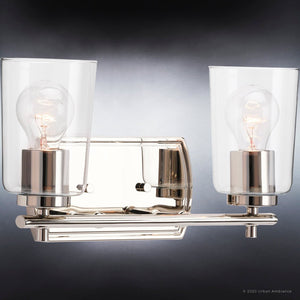 A beautiful bathroom light fixture with two UHP4151 Traditional Bath Light 7.625''H x 13.875''W, Polished Nickel Finish, Esperance Collection glass bulbs