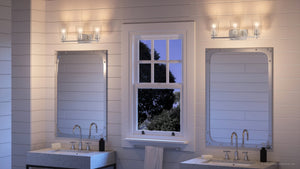 A bathroom with two sinks and a window featuring the UHP4152 Traditional Bath Light 7.625''H x 23''W, Polished Nickel Finish from Urban Ambiance's