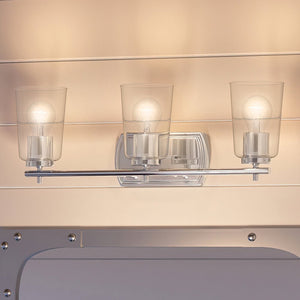 A unique bathroom with three gorgeous UHP4152 Traditional Bath Light 7.625''H x 23''W, Polished Nickel Finish, Esperance Collection light fixtures hanging above a mirror by