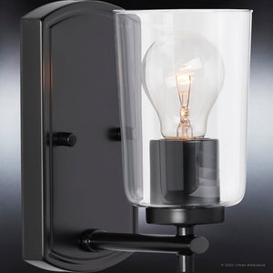 An Urban Ambiance UHP4154 Traditional Wall Sconce, a unique lighting fixture with a Midnight Black Finish and light bulb.