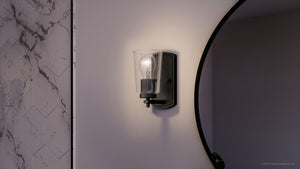 A beautiful bathroom with a UHP4154 Traditional Wall Sconce 7.75''H x 4.5''W, Midnight Black Finish, Esperance Collection from Urban Ambiance and