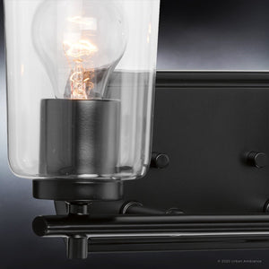 An Urban Ambiance UHP4155 Traditional Bath Light 7.625''H x 13.875''W with a beautiful light bulb on it.