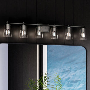 A gorgeous bathroom with an Urban Ambiance UHP4158 Traditional Bath Light 7.625''H x 48.5''W, Midnight Black Finish, Esperance Collection lighting fixture on the