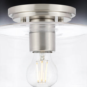 An Urban Ambiance ceiling lamp with a glass shade and a luxurious light bulb.