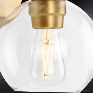 A unique vintage wall sconce with a glass globe and a gold bulb from the Belfast Collection by Urban Ambiance.