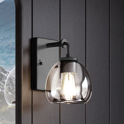 A Unique Urban Ambiance UHP4184 Industrial Wall Sconce with a gorgeous glass shade.