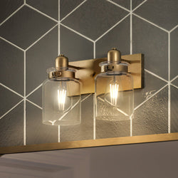 An Urban Ambiance bathroom lighting fixture with two UHP4191 Vintage Bath Light 8.625''H x 13.25''W, Olde Brass Finish, Bridgeport Collection glass jars