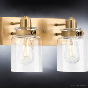 An UHP4191 Vintage Bath Light 8.625''H x 13.25''W, Olde Brass Finish, Bridgeport Collection bathroom luxury light fixture with two glass jars