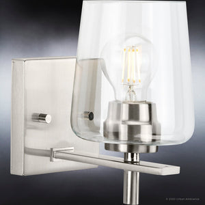 A luxury wall sconce from the Swan-Hill Collection by Urban Ambiance with a glass bulb.