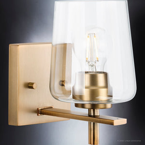 An UHP4204 New Traditional Wall Sconce with a glass shade is a gorgeous lighting fixture.