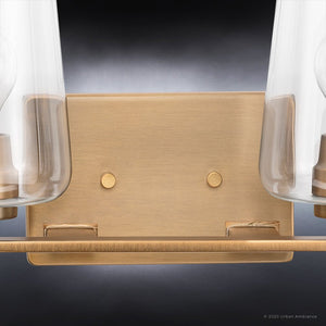 An Urban Ambiance bathroom fixture with two UHP4207 New Traditional Bath Light 8.5''H x 34''W, Olde Brass Finish, Swan-Hill Collection light bulbs and