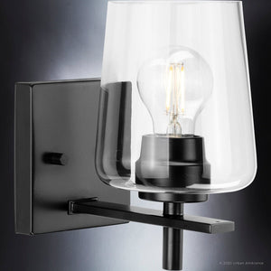 An UHP4208 New Traditional Wall Sconce 8.5''H x 5''W, Midnight Black Finish, Swan-Hill Collection with a clear glass bulb that is unique and