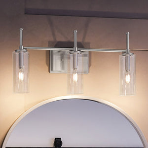 A beautiful Urban Ambiance bathroom vanity with three UHP4222 Contemporary Bath Light fixtures and a mirror.