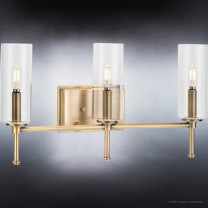 Three unique UHP4226 Contemporary Bath Light 11.5''H x 22.125''W in Olde Brass Finish with clear glass shades from the Parkes Collection by Urban Ambiance