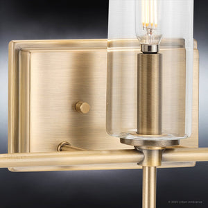 A unique brass wall sconce with a beautiful clear glass shade.