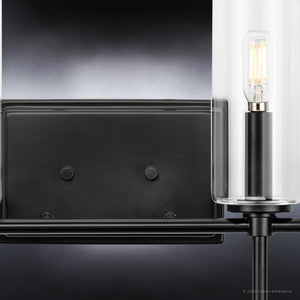 A unique bathroom light fixture with two glass cylinders and a black frame, the UHP4231 Contemporary Bath Light 11.5''H x 31.625''W with a Midnight