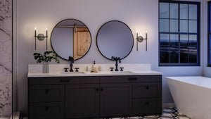 An Urban Ambiance black and white bathroom with a beautiful tub and two mirrors.