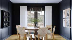 A luxury dining room with black walls and wooden floors featuring the UHP4239 Contemporary Chandelier 10.375''H x 30''W, Brushed Nickel Finish from the Parkes Collection