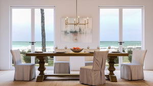 An Urban Ambiance UHP4241 Contemporary Chandelier 10.375''H x 30''W, Olde Brass Finish, Parkes Collection with a unique view of the ocean.