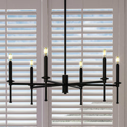 A unique Urban Ambiance UHP4243 Contemporary Chandelier 10.375''H x 30''W, Midnight Black Finish, Parkes Collection in front of a beautiful window with shutters