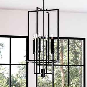 A unique UHP4246 Contemporary Chandelier 31.375''H x 15''W, Midnight Black Finish, Parkes Collection lighting fixture hanging over a window in a living room