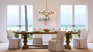 A dining room with a gorgeous Urban Ambiance UHP4252 Traditional Chandelier 14''H x 30''W lighting fixture.