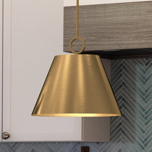 A beautiful UHP4254 New Traditional Pendant with a gorgeous Brushed Bronze Finish from the Coronado Collection by Urban Ambiance hanging over a kitchen counter.