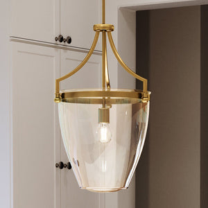 An UHP4256 Unique Pendant 23.375''H x 15.25''W, Brushed Bronze Finish from the Coronado Collection by Urban Ambiance is hanging over a