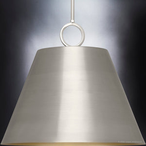 An Urban Ambiance pendant light with a unique metal shade on a beautiful dark background from the Coronado Collection.