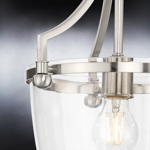 A unique Urban Ambiance pendant lamp with a brushed nickel finish, part of the Coronado Collection, featuring a clear glass bulb.