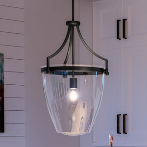 An Urban Ambiance pendant lighting fixture hanging over a kitchen counter with a touch of luxury.