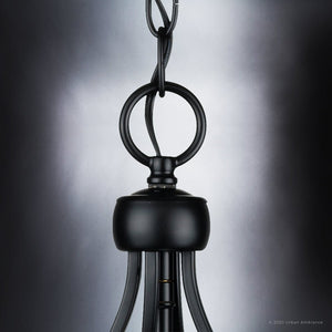 A UHP4279 Tranditional Chandelier 19.75''H x 10.875''W, Midnight Black Finish, Coronado Collection pendant light hanging on a black background is gorgeous