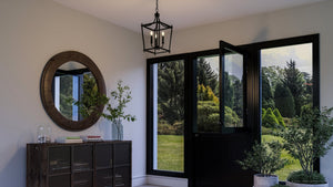 An entryway with a unique UHP4279 Traditional Chandelier 19.75''H x 10.875''W, Midnight Black Finish, Coronado Collection by Urban Ambiance and a
